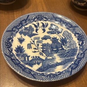 Vintage Blue and White Blue Willow three teacups and one small saucer.